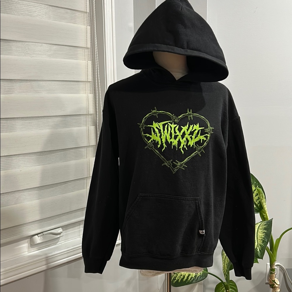 Black Sweater with Green Heart Design